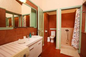 a bathroom with a sink and a shower and a toilet at Madlen Apartments in Nea Skioni +15 photos