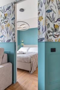 a bedroom with a bed and a blue door at Richard's Apartments - Garibaldi in Milan