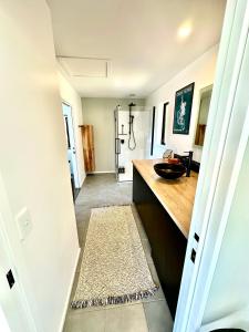 a bathroom with a sink and a counter top at Stunning house with amazing view in Diamond Harbour