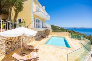 an image of a villa with a swimming pool at Villa Sunrise in Nisaki