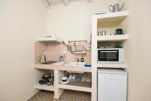 Kuchyň nebo kuchyňský kout v ubytování Eleni Cottage