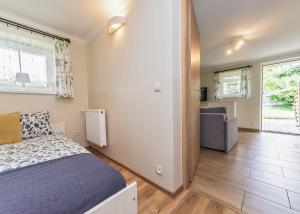 Łóżko lub łóżka w pokoju w obiekcie Willa Aleksandra - Apartamenty