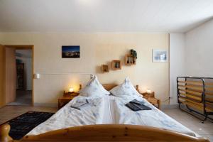 a bedroom with a large bed in a room at Ferienwohnung Wiesental in Meisburg