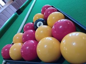 a group of billiard balls on a pool table at The Merlin Hotel in Blackpool