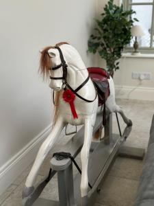 a statue of a white horse on a table at Meathpark Country House in Coleraine