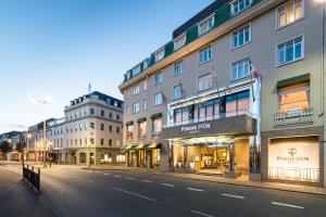 an empty city street with buildings on the side at Pomme d'Or Hotel in Saint Helier Jersey