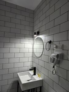 a bathroom with a sink and a mirror at DRO Hotel in Kutaisi