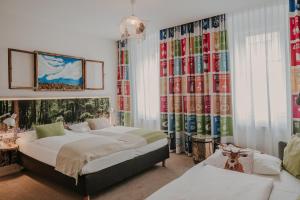 Postel nebo postele na pokoji v ubytování Boutiquehotel Stadthalle