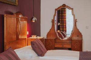 Postel nebo postele na pokoji v ubytování Boutiquehotel Stadthalle