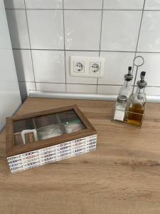 a wooden box with two bottles on a wooden floor at Cotillo in El Cotillo +36 photos