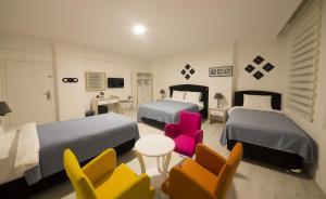 Postel nebo postele na pokoji v ubytování Bilge Suite Hotel + 37 fotografií