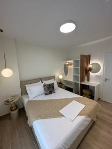 Ένα ή περισσότερα κρεβάτια σε δωμάτιο στο K & L Luxury Suite