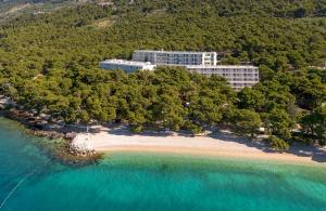 an aerial view of a resort and a beach at Bluesun Hotel Marina in Brela