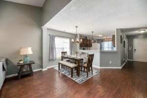 a dining room and kitchen with a table and chairs at Stoney Oasis in Charleston