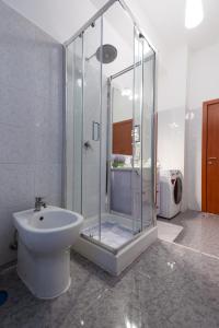 a bathroom with a shower and a toilet and a sink at Casa Giulia in Castellammare di Stabia