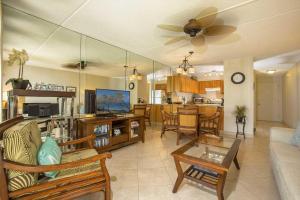 a living room with a couch and a table at Kihei Akahi Resort - Unit C313 in Wailea
