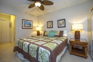 a bedroom with a bed and a ceiling fan at Kihei Akahi Resort - Unit C313 in Wailea +38 photos