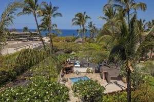 an aerial view of a resort with palm trees and a pool at Kihei Akahi Resort - Unit C313 in Wailea