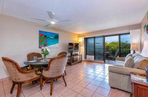 a living room with a couch and a table at Kihei Akahi Resort - Unit D114 in Wailea