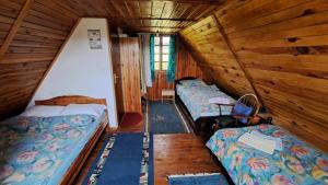 Postel nebo postele na pokoji v ubytování Vile SRCE