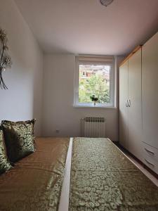 Postel nebo postele na pokoji v ubytování Cozy Sarajevo City Apartment