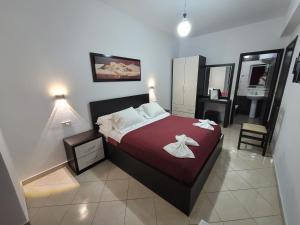 Postel nebo postele na pokoji v ubytování Haris Hotel