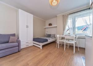 Łóżko lub łóżka w pokoju w obiekcie Willa Aleksandra - Apartamenty