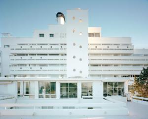 a white building with a large white building at La Rotonda - Incredible Méditerranéen and St Tropez view 360! Centre ville 5 mns in Saint-Tropez