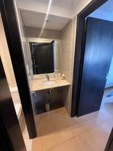 a bathroom with a sink and a mirror at Dpto vista al cerro in Salta