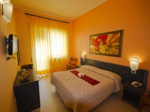 Postel nebo postele na pokoji v ubytování Hotel Serapo