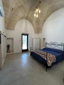 Postel nebo postele na pokoji v ubytování Il Trullo di Bina