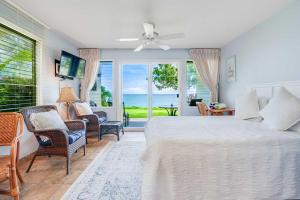 a bedroom with a bed and a view of the ocean at Kapaa Sands 10 in Kapaa +45 photos