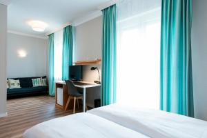 Postel nebo postele na pokoji v ubytování Hotel Villa Solln