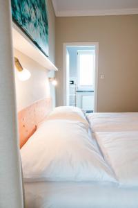 Postel nebo postele na pokoji v ubytování Hotel Villa Solln