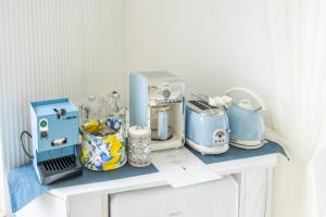a counter with a bunch of appliances on it at B&B L'Agapanto in Capri