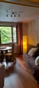 Area soggiorno di Appartements & Chambres Les Loges du Capucin