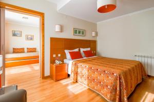 Uma cama ou camas num quarto em Hotel Berne