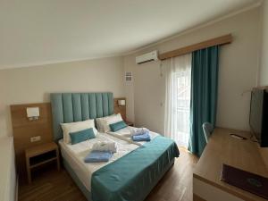 Vile Oliva Hotel & Resort客房内的一张或多张床位