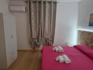 Postel nebo postele na pokoji v ubytování B & B Da Rosa