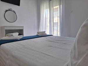 Postel nebo postele na pokoji v ubytování Alana apartment