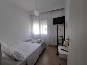 Postel nebo postele na pokoji v ubytování Alana apartment