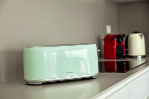 a toaster oven sitting on a counter in a kitchen at Apartamentos Arenal 2 in Jávea