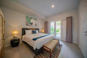 Postel nebo postele na pokoji v ubytování Deja Blu Villa