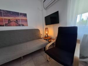 Posezení v ubytování Alana apartment