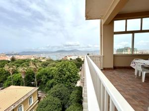 a balcony with a view of the ocean at NURAS - Penthouse Antonietta with view in Alghero