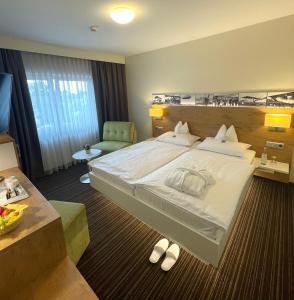 Postel nebo postele na pokoji v ubytování Hotel Nothnagel