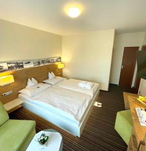 Postel nebo postele na pokoji v ubytování Hotel Nothnagel