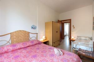 a bedroom with a bed and a dresser at Villa Margi in Scopello +27 photos