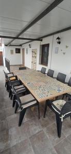a large table and chairs in a room at Casa rural El Candil in Olivenza