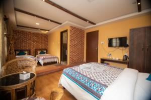 Letto o letti in una camera di Hong Si Hotel- A Home Away from Home